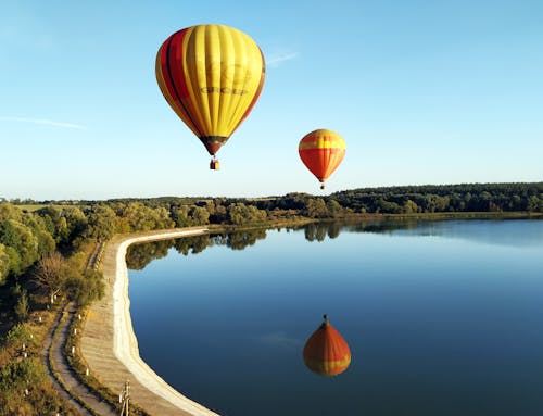Hot Air Balloons Flying over the Lake