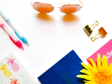 Desktop background of sunglasses, blue, yellow, paper clips