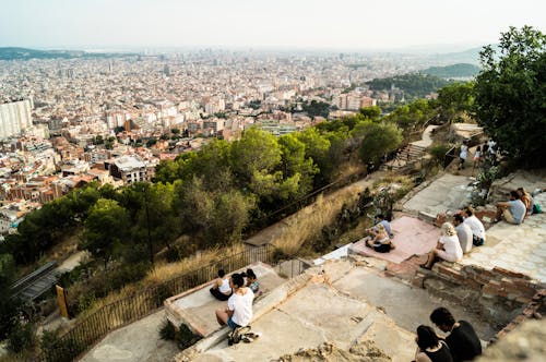Free People on the Hill Overlooking the City Stock Photo