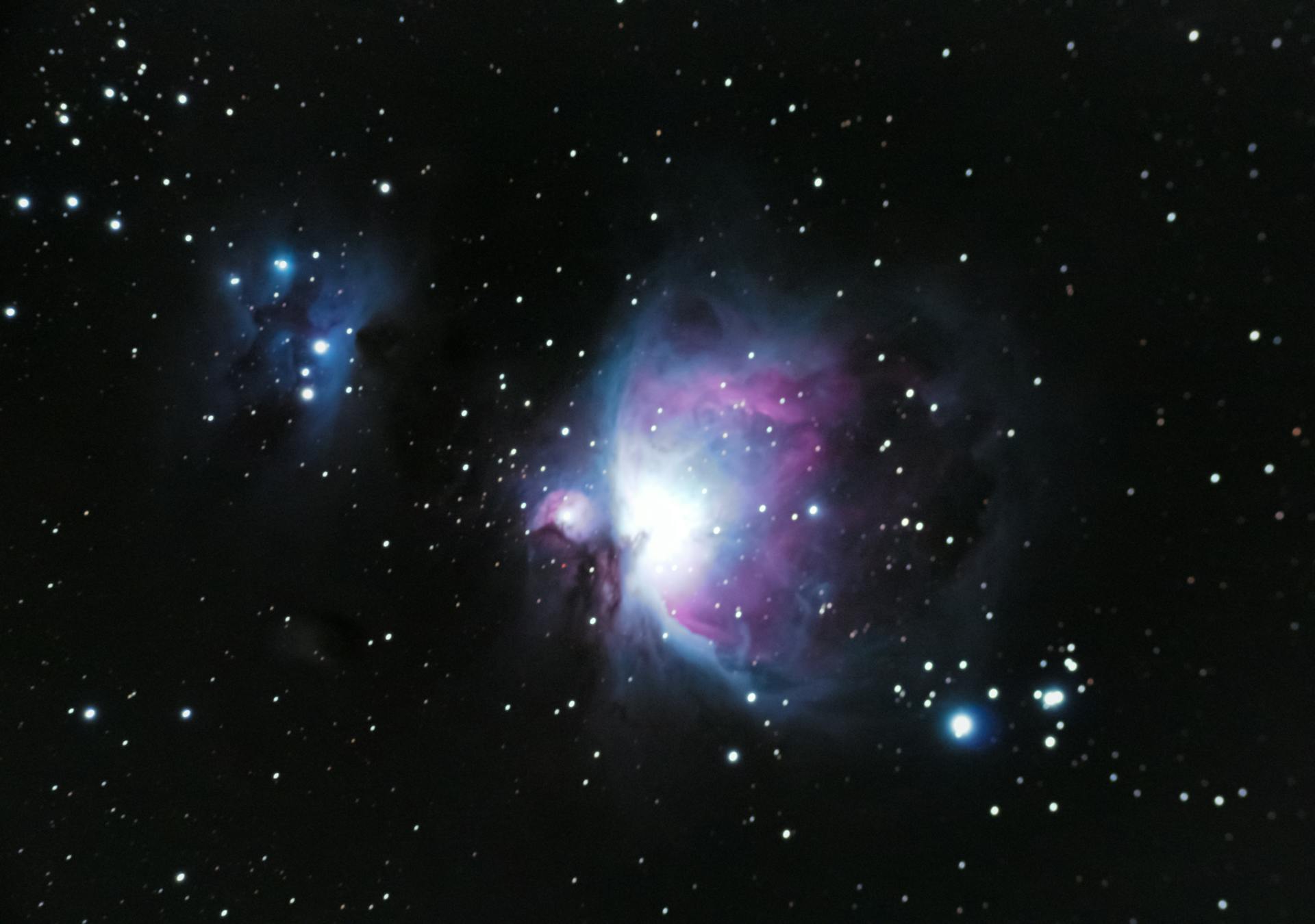 Explore the captivating beauty of the Orion Nebula amidst a star-filled night sky.