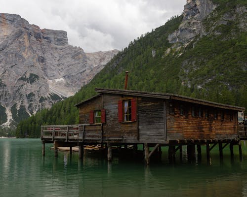 Brown Wooden House on Lake