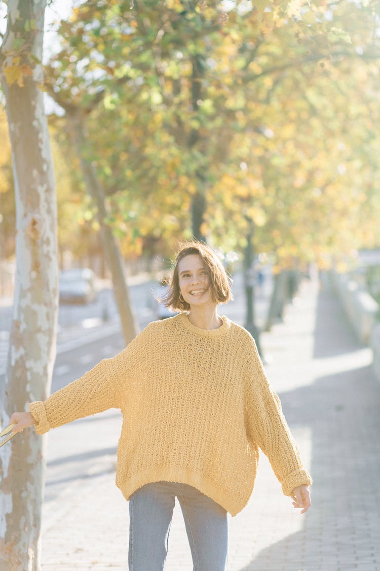 A Woman In A Yellow Sweater