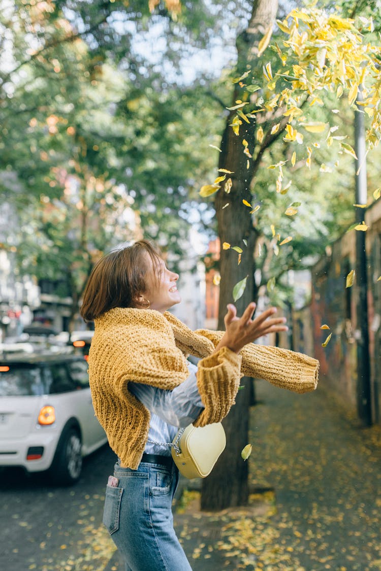 A Woman Catching Falling Leaves