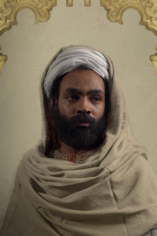 Free Elegant portrait of a man in traditional Egyptian attire featuring a beige cloak and headscarf. Stock Photo