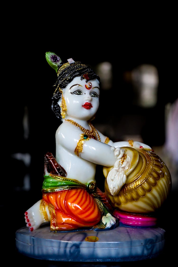 A Figurine Of Krishna