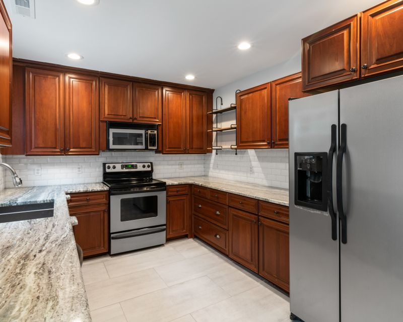 Renovated kitchen with wooden cabinetry