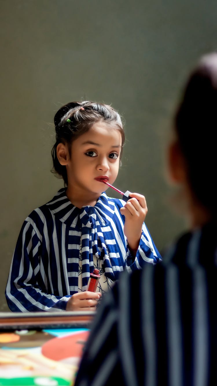 A Girl Using A Lip Tint