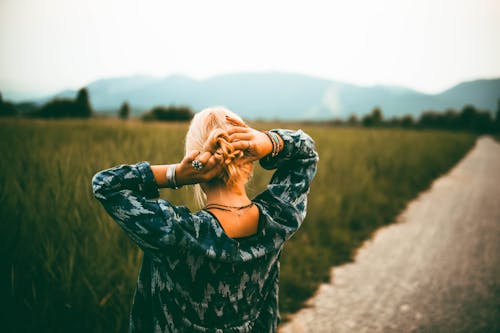 Woman Placing Her Both Hands Behind Her Head