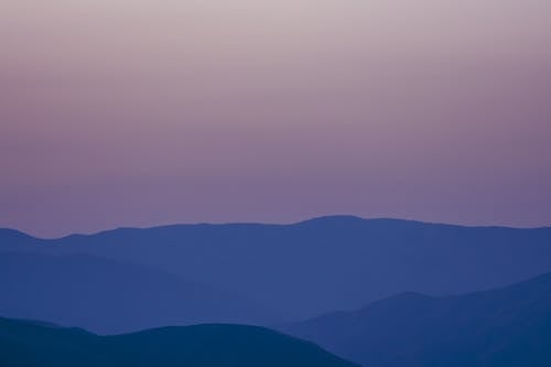 Sunset sky over mountainous terrain