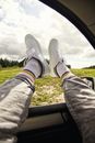 Person in Gray Pants and Gray Sneakers