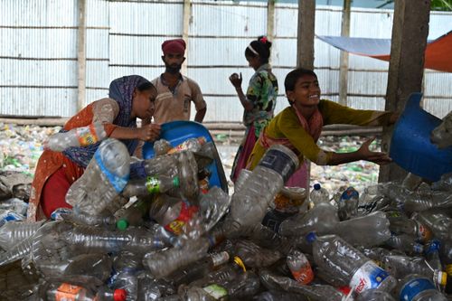 Free Group of women sorting plastic bottles for recycling in Chattogram, Bangladesh. Stock Photo