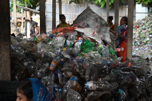 Free Heap of Plastic Bottles on a Junkyard  Stock Photo