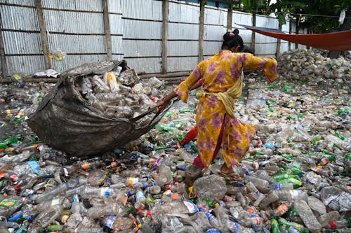 Person Pulling a Sack of Garbage 