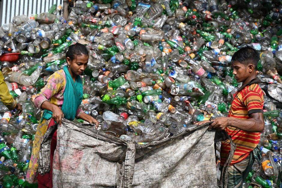 Workers sorting plastic bottles at a recycling facility in Chattogram, Bangladesh.