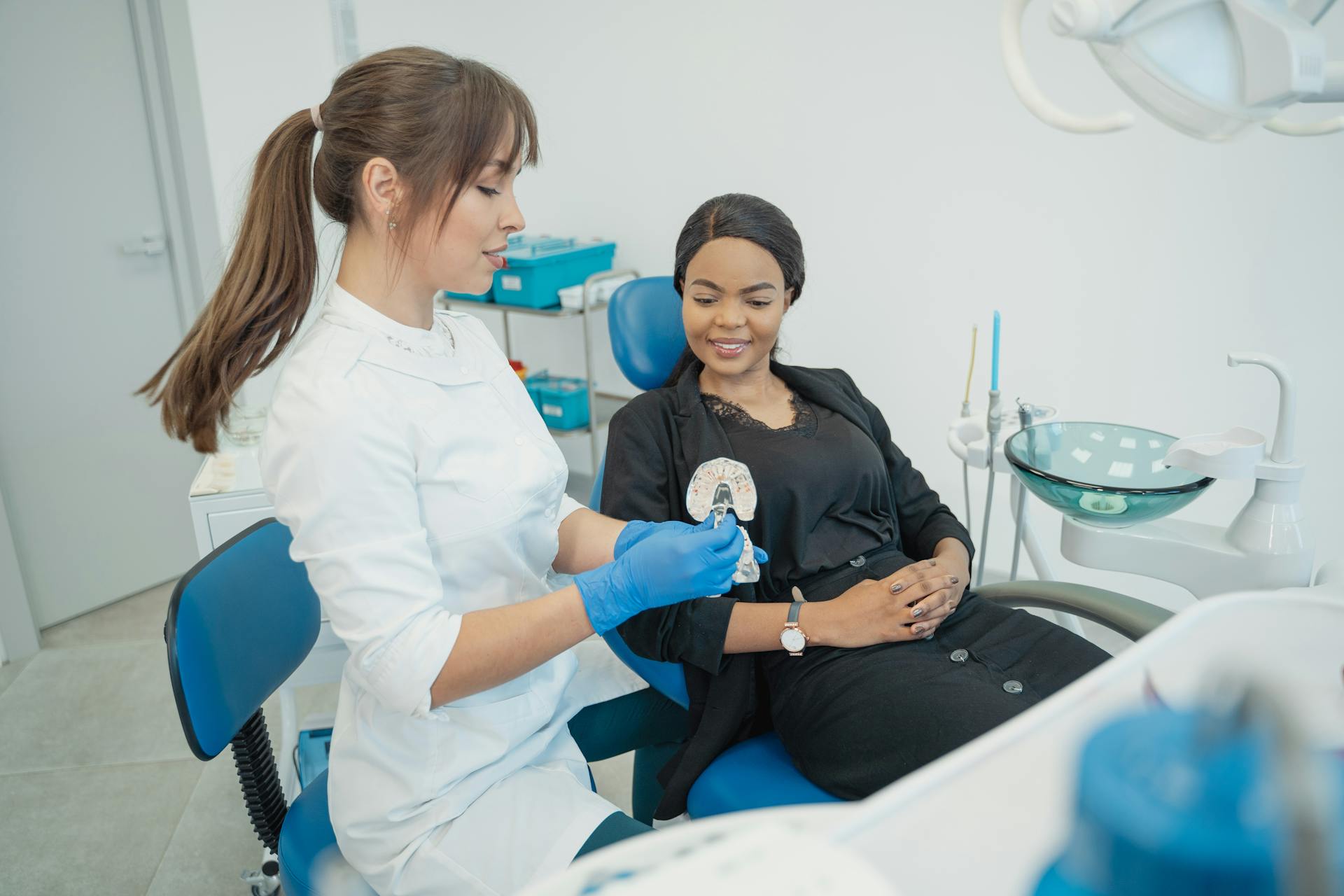 A Dentist Servicing a Customer