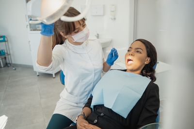 Dentist and assistant working together in clinic