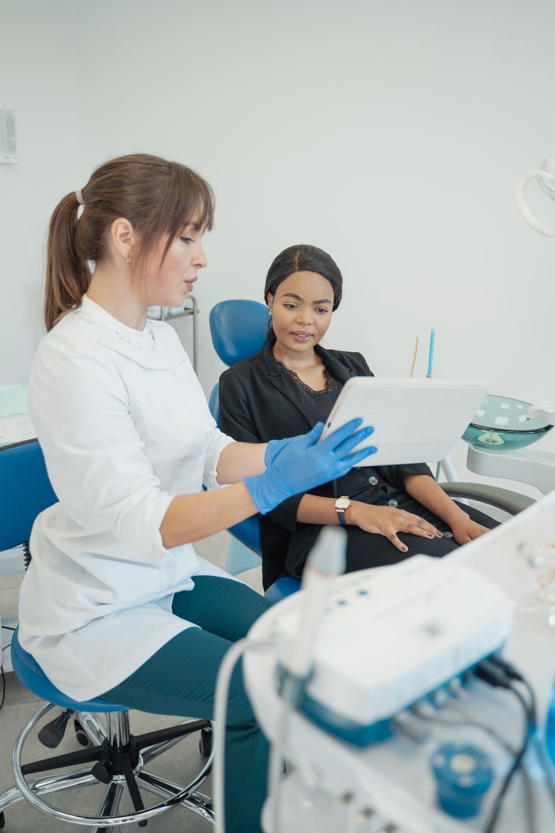 Dentist speaking with a patient