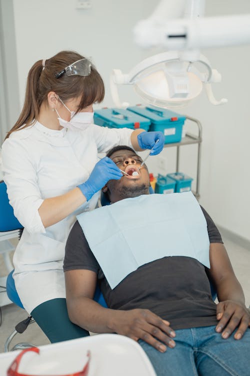 Free A Dentist Treating a Patient Stock Photo
