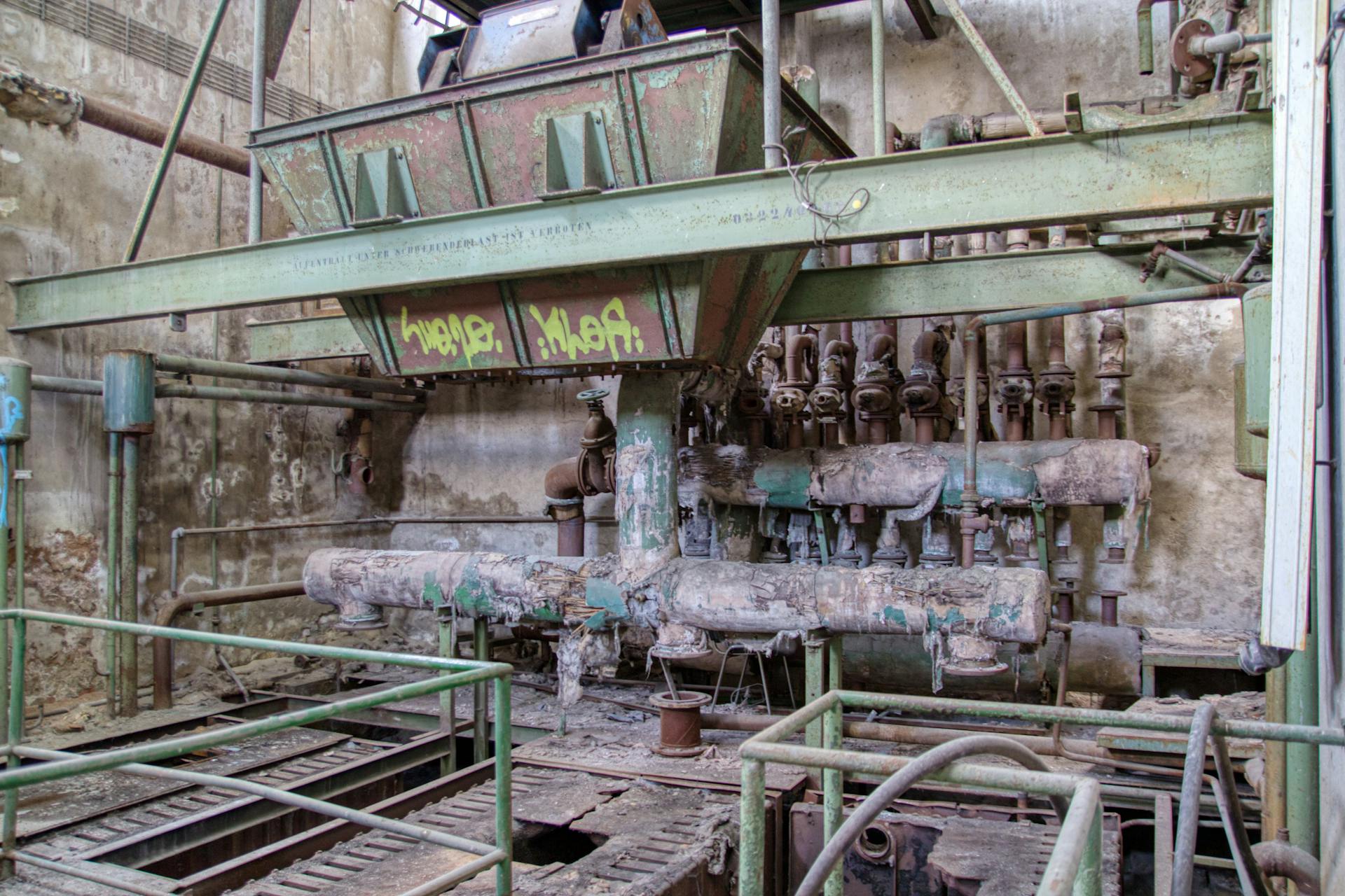 Old industrial machinery in a deteriorating factory in Leipzig, Germany.