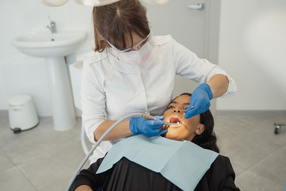 Dentist explaining treatment covered by dental insurance