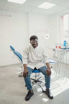 Smiling dental professional in a bright clinic ready for patients.
