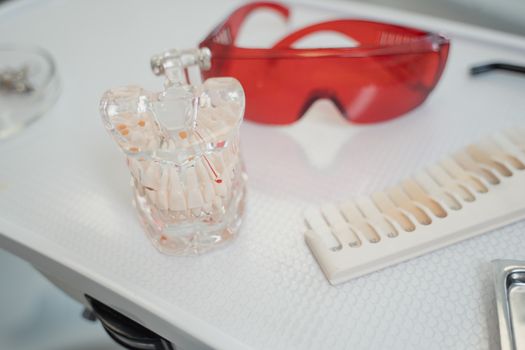 Clear Glass Perfume Bottle on White Table