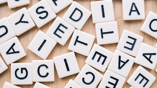 Scrabble Tiles on Wooden Surface