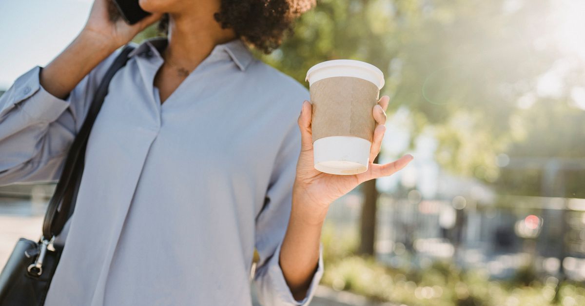 person standing outside in morning sunlight, no phone in hand