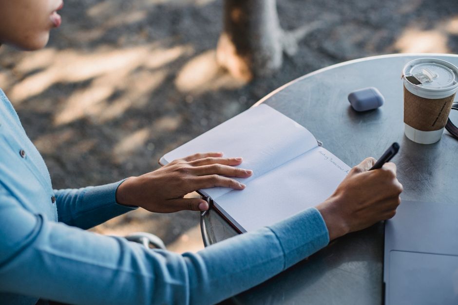 student studying with coffee and notes