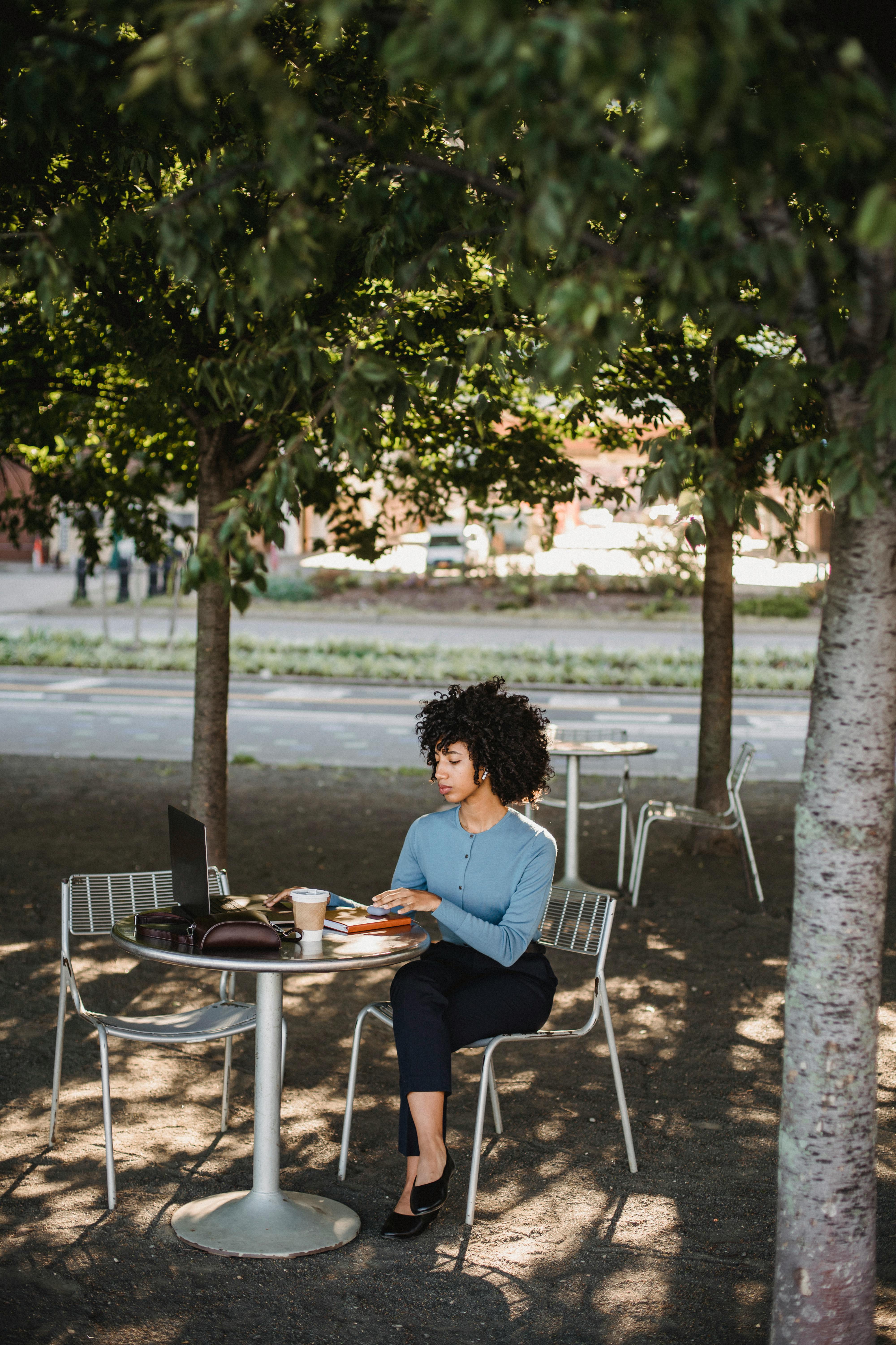 Woman Sitting on Chair Upside Down · Free Stock Photo