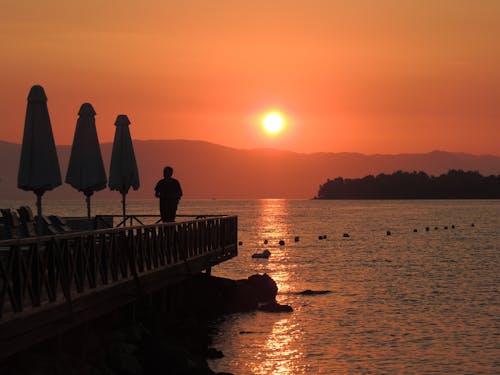 Free A Scenic Sunrise by the Seaside in Kontokali, Greece Stock Photo