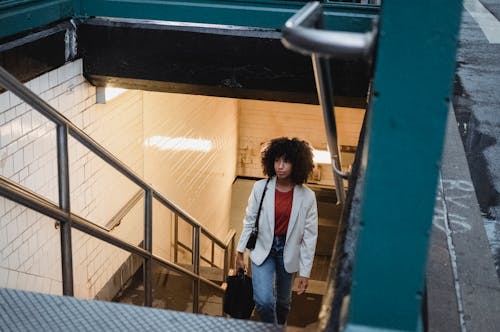 Woman Walking Up Stairs