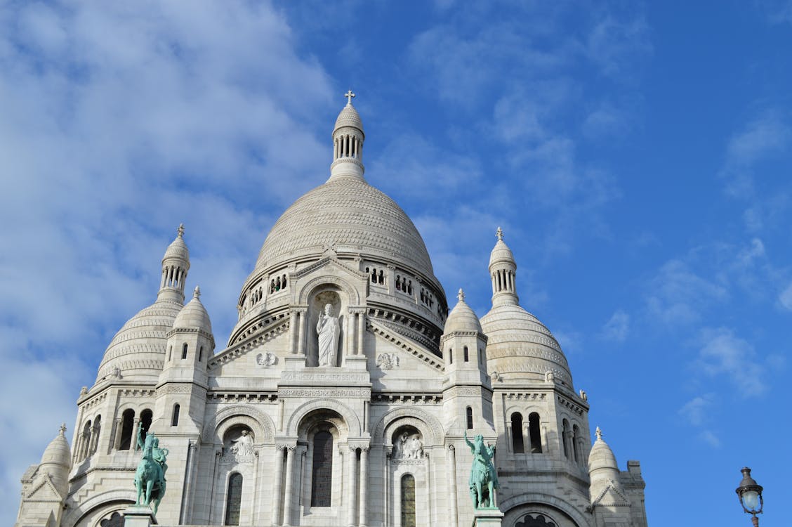 Gray and White Cathedral Under Cloudy Blue Sky