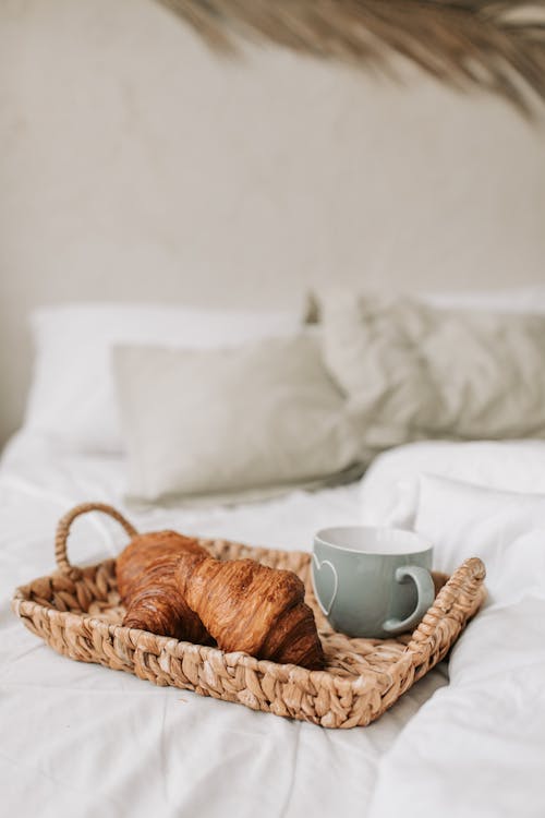 Free Photo of a Basket with Food on a Bed Stock Photo