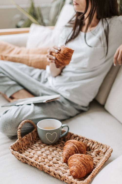 A Person Sitting Beside a Breakfast Tray