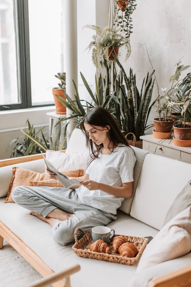 A Woman Reading The Newspaper 