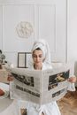 Woman in White Hijab Holding White Round Tray