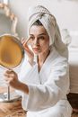 Woman in White Hijab Holding Round Stainless Steel Bowl