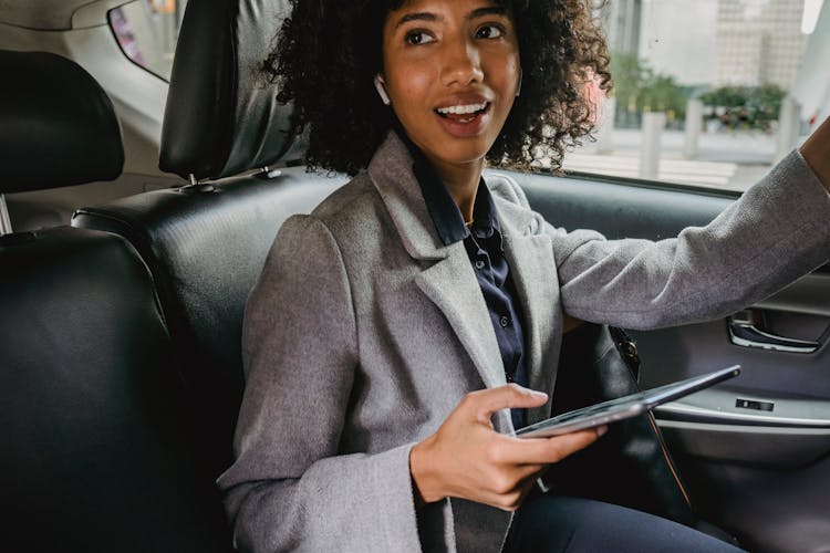 Woman In Suit In Car