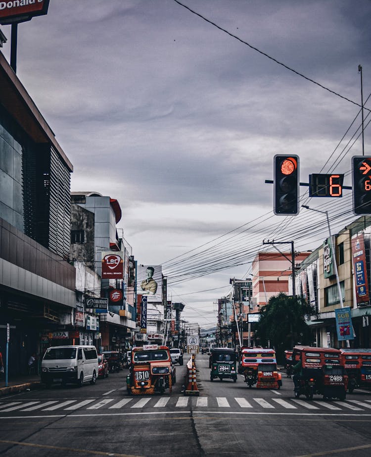 Photograph Of A Road With Cars And A Stoplight