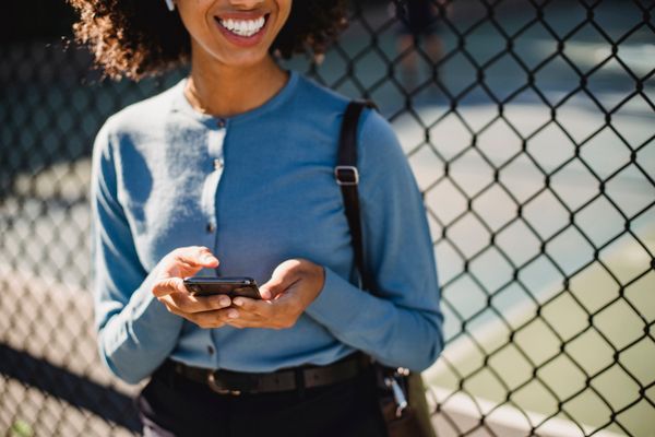 Woman safely checking her phone while dating online