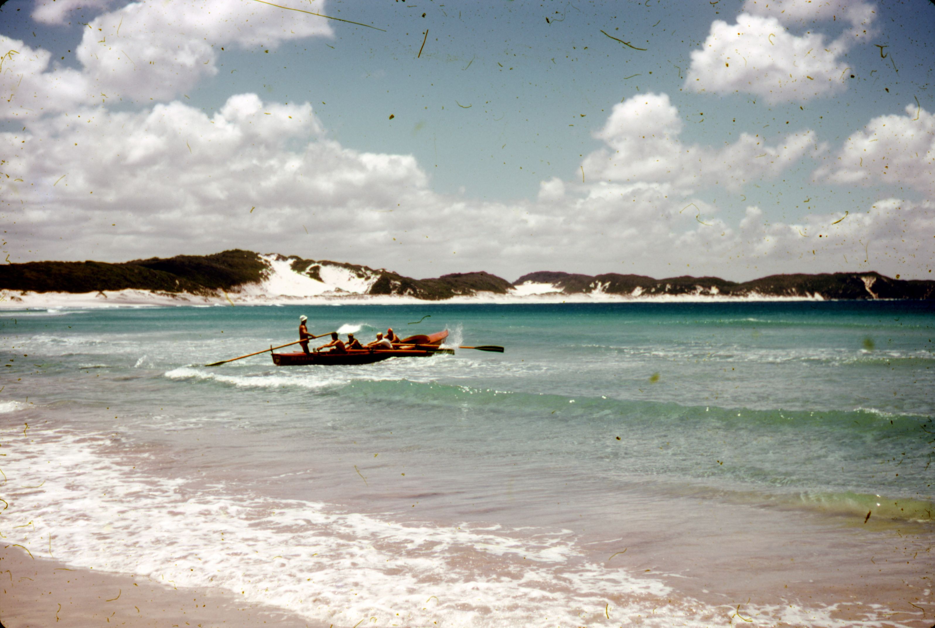 People Riding on Boat on Sea Near the Shore · Free Stock Photo