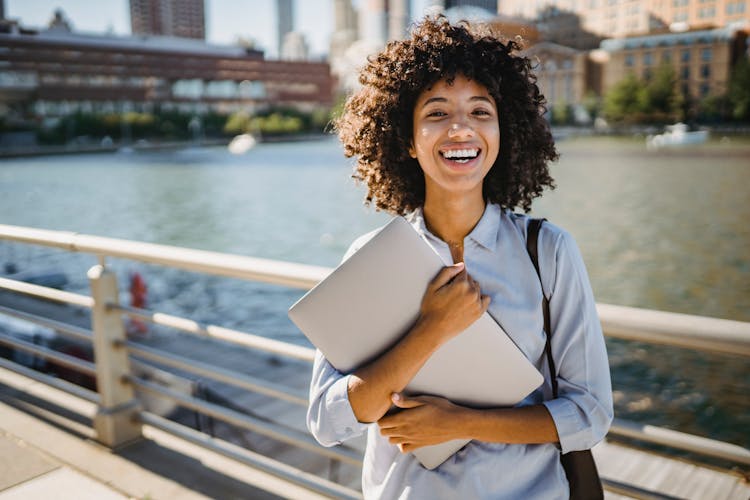 Curly Hair Woman Holding Gray Folder