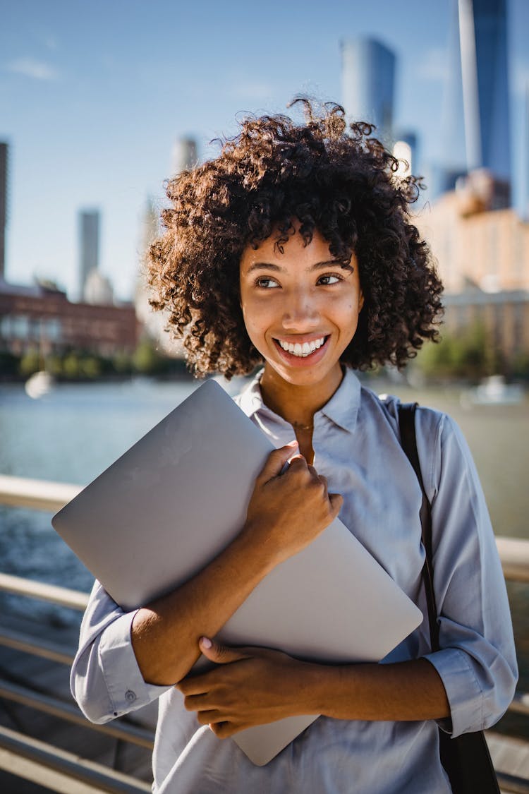 Curly Hair Woman Holding Gray Folder