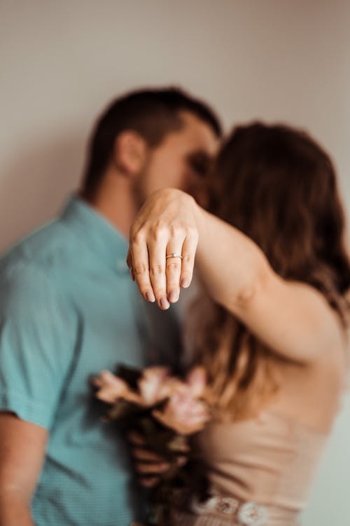 Free Selective Focus Photo of a Woman's Hand with an Engagement Ring Stock Photo