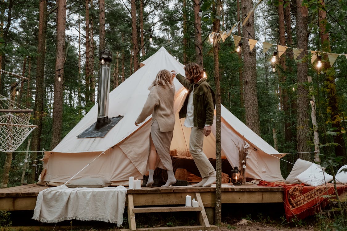 Free Photograph of a Couple Dancing Near a White Tent Stock Photo