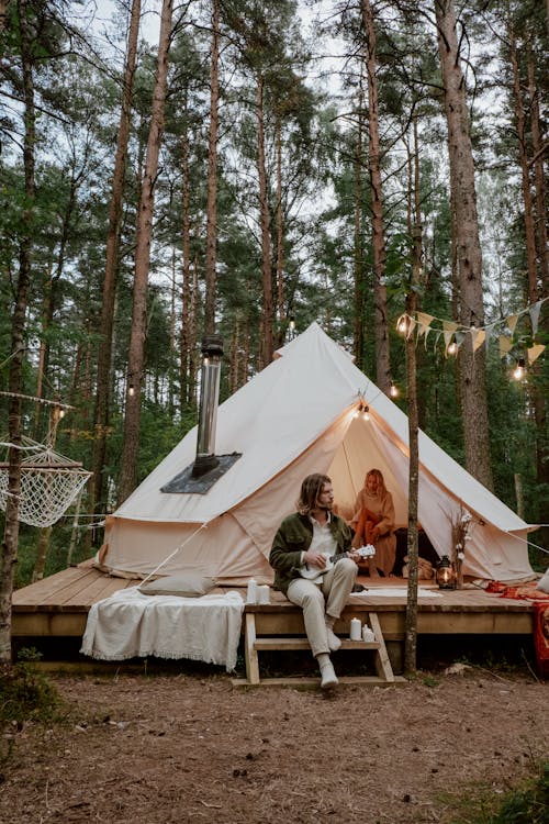 Free Photo of a Couple Camping Together in the Woods Stock Photo