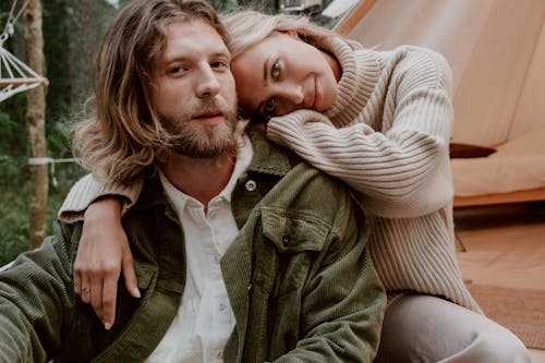 Photograph of a Woman Laying on a Man's Shoulder