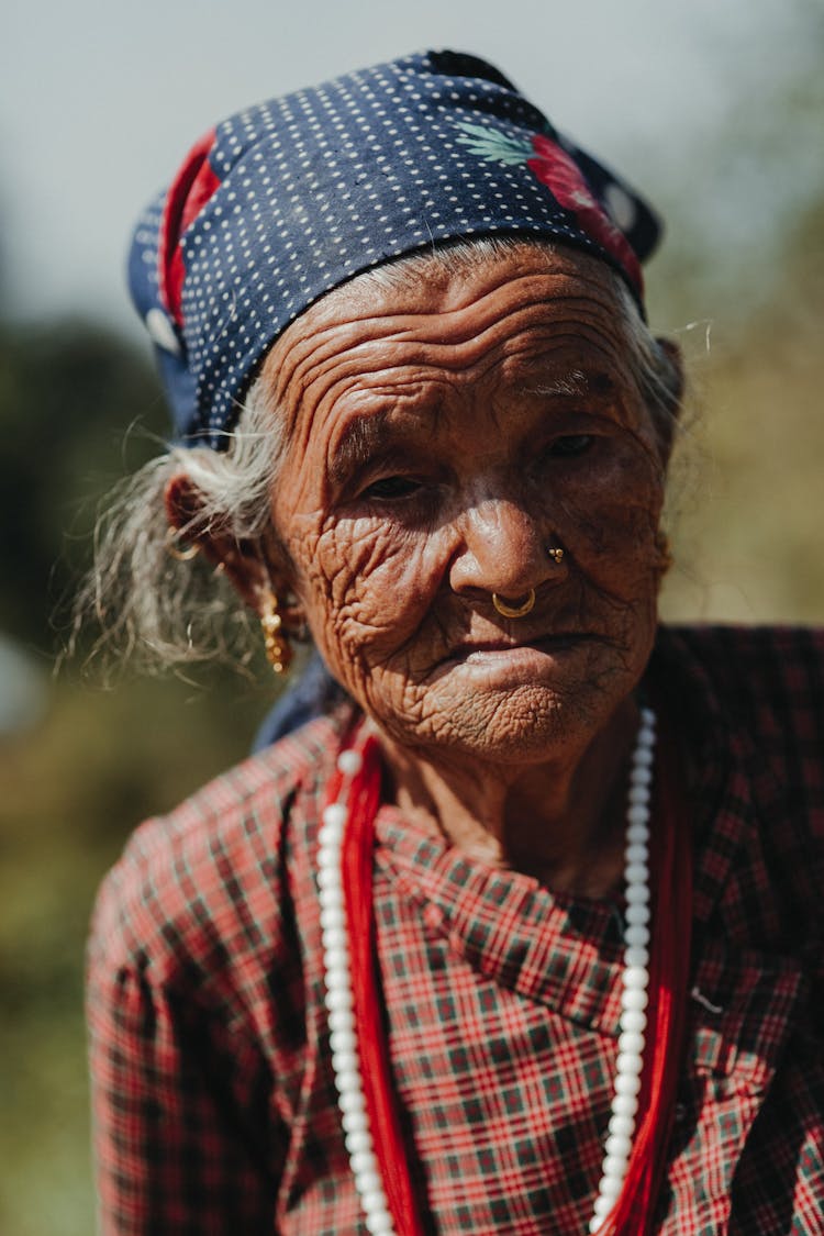 Elderly Indian Woman In Beads On Street