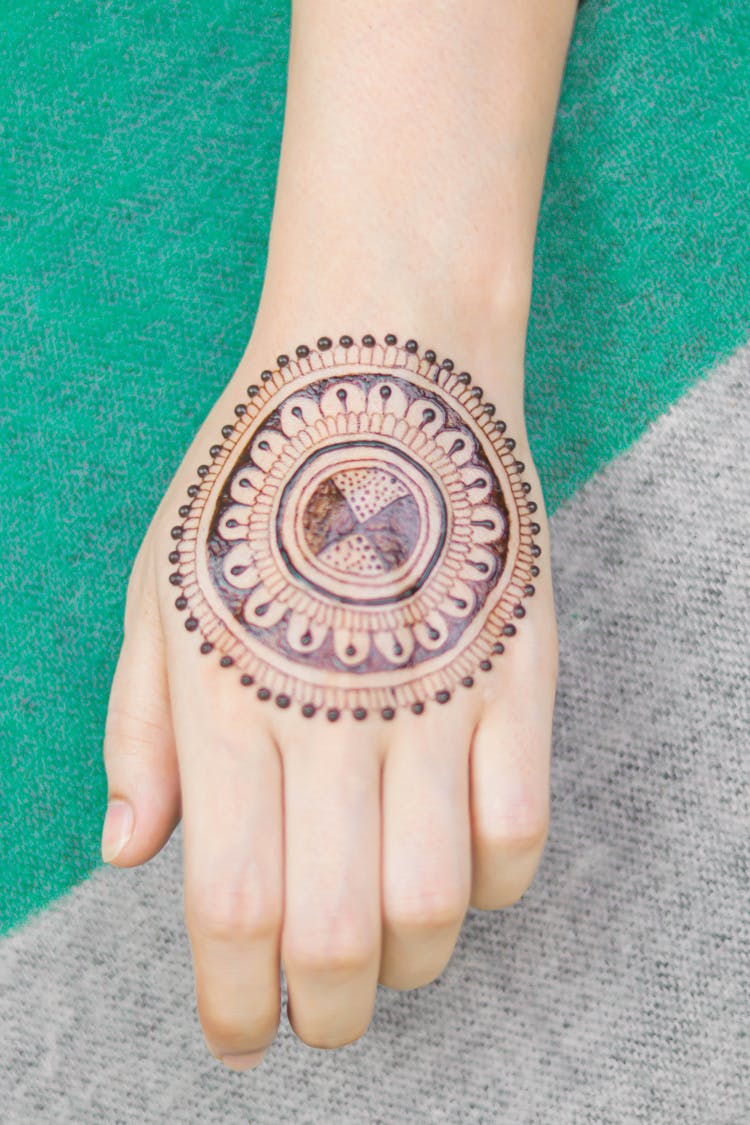 Close-Up Photo Of A Henna Tattoo On A Person's Hand